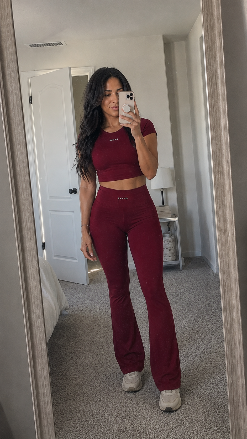 Heather Everett wearing Dfyne maroon activewear set