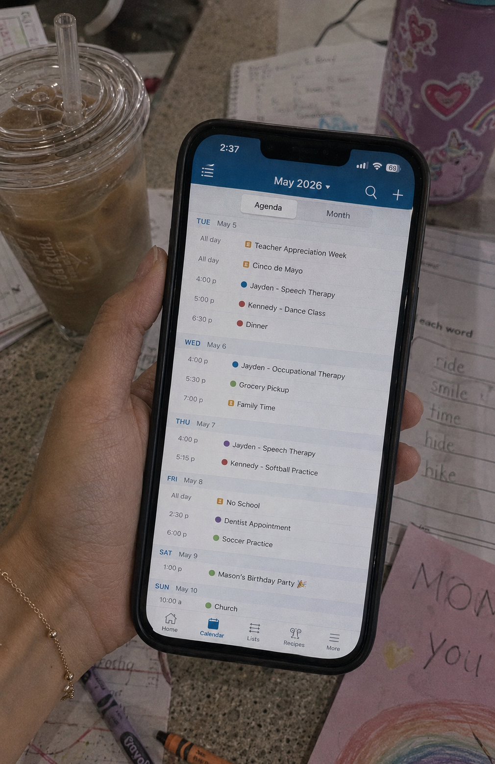 Cozy Family Organizer app showing family calendar agenda on iPhone